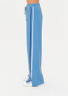 THE UPSIDE women's lagoon-blue high-waisted Fortuna Roma Pant made with lenzing viscose fabrication features an elasticated waist with drawcord, stripe binds down sides, invisible zips at hems, and pockets on front and back.