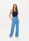 THE UPSIDE women's lagoon-blue high-waisted Fortuna Roma Pant made with lenzing viscose fabrication features an elasticated waist with drawcord, stripe binds down sides, invisible zips at hems, and pockets on front and back.