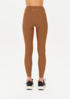 THE UPSIDE women's women's brown tobacco mid rise 25inch midi legging is made from recycled soft peach with moisture wicking, breathable and quick drying properties.
