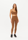 THE UPSIDE women's women's brown tobacco mid rise 25inch midi legging is made from recycled soft peach with moisture wicking, breathable and quick drying properties.