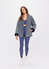 THE UPSIDE women's denim-blue Nouveaux Daria Jacket made with organic cotton jersey fabrication is an oversized zip-through quilted jacket featuring twin needle stitch detailing, snap buttons and printed indigo paisley lining.