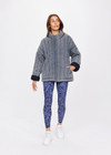 THE UPSIDE women's denim-blue Nouveaux Daria Jacket made with organic cotton jersey fabrication is an oversized zip-through quilted jacket featuring twin needle stitch detailing, snap buttons and printed indigo paisley lining.