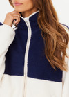 THE UPSIDE women's white and navy Harlow Zip Through Jacket made with double sided recycled fleece features a full zip with contrasting mocha binds, white and navy colour blocks, and elastic at waist and cuffs
