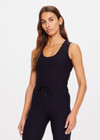 THE UPSIDE women's black Onyx Kori Crop Tank is made from recycled soft peached fabric with a brushed handfeel and moisture-wicking, breathable and quick-drying properties. This full coverage cropped tank top features a scoop front and an internal shelf bra with removable cups.