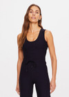 THE UPSIDE women's black Onyx Kori Crop Tank is made from recycled soft peached fabric with a brushed handfeel and moisture-wicking, breathable and quick-drying properties. This full coverage cropped tank top features a scoop front and an internal shelf bra with removable cups.
