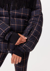 THE UPSIDE women's black check Lumiere Fox Puffer Jacket is made with recycled fabric, for a relaxed fit. This puffer is fully lined and insulated with polar fleece, ideal for the snow.