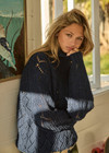 THE UPSIDE women's navy Clementine Knit Crew made with organic cotton chunky knit, designed for a relaxed fit. This high neck lifestyle crew features ribbed hem, cuffs and neckline.