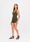 THE UPSIDE women's green Orchard Lia Onesie is made with textured jacquard fabric, designed for a firm fit. This onesie features a 3 inch leg and inner shelf bra, ideal for yoga.