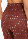 THE UPSIDE women's polka dot Maho 25 inch High Rise Midi Pant is made from a soft recycled ribbed fabric and features a soft folded waistband and contrast splice plan down the sides.