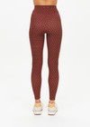THE UPSIDE women's polka dot Maho 25 inch High Rise Midi Pant is made from a soft recycled ribbed fabric and features a soft folded waistband and contrast splice plan down the sides.