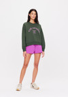 THE UPSIDE women's green Jetset Paloma Crew is made with organic cotton for an oversized fit. This boxy crew features ribbed neck cuffs and hem, and a drop shoulder relaxed style.