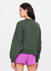 THE UPSIDE women's green Jetset Paloma Crew is made with organic cotton for an oversized fit. This boxy crew features ribbed neck cuffs and hem, and a drop shoulder relaxed style.