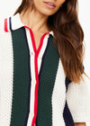 THE UPSIDE women's white, red, navy and green Reverie Chino Shirt is made with organic cotton for a true to size fit. This relaxed button through features a ribbed collar and hem.
