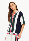 THE UPSIDE women's white, red, navy and green Reverie Chino Shirt is made with organic cotton for a true to size fit. This relaxed button through features a ribbed collar and hem.