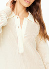 THE UPSIDE women's natural Alana Knitted Sweater is made with organic knit cotton, for an oversized fit. This knitted polo features a button front, and ribbed knit hem and cuffs.