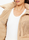 THE UPSIDE women’s khaki Fairbanks Fox Puffer Jacket is made from recycled fabric. The water resistant Puffer Jacket features western fringe trim and zip pockets. Designed for Après-ski and winterwear.
