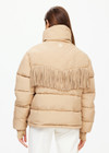 THE UPSIDE women’s khaki Fairbanks Fox Puffer Jacket is made from recycled fabric. The water resistant Puffer Jacket features western fringe trim and zip pockets. Designed for Après-ski and winterwear.