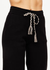 THE UPSIDE women’s black Fairbanks Jojo Knit Jogger is made from organic cotton. The cuffed pants features side pockets and soft knitted waistband. Designed for Après-ski and winterwear.