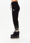 THE UPSIDE women’s black Fairbanks Jojo Knit Jogger is made from organic cotton. The cuffed pants features side pockets and soft knitted waistband. Designed for Après-ski and winterwear.