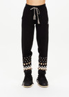 THE UPSIDE women’s black Fairbanks Jojo Knit Jogger is made from organic cotton. The cuffed pants features side pockets and soft knitted waistband. Designed for Après-ski and winterwear.