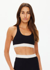 THE UPSIDE women's black Jagger Ness Racerback Bra is made from recycled sof peach with a brushed handfeel and moisture wicking, breathable and quick drying properties. This supportive, t back sports bra feature removable bust cups and discreet mesh pocket at the back. Designed for yoga, pilates and barre.