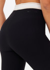 THE UPSIDE women's Jagger 25inch Midi Pant is made from recycled soft peached with moisture wicking, breathable and quick drying properties. The mid rise yoga legging features textured stripe elastic waistband and cuffs.