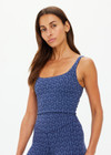 THE UPSIDE women's blue abstract print Farrow Lucia Scoop Crop is made from a recycled jacquard rib fabric with breathable, quick drying and moisture wicking properties. This crop top features a scoop neck and back, a shelf bra and removable cups. Designed for yoga, pilates and barre.