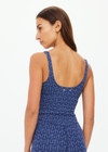 THE UPSIDE women's blue abstract print Farrow Lucia Scoop Crop is made from a recycled jacquard rib fabric with breathable, quick drying and moisture wicking properties. This crop top features a scoop neck and back, a shelf bra and removable cups. Designed for yoga, pilates and barre.