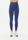 THE UPSIDE women's blue abstract print Farrow 25 inch High Midi Pant is made from a recycled jacquard rib fabric with breathable, quick drying and moisture wicking properties. This high waisted legging features a V-shaped front and is designed for yoga, pilates and barre.