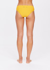 THE UPSIDE women's yellow marigold Dunes Olympia Pant is made from recycled textured rib fabric with moisture wicking properties. The low waisted, classic sporty swim bottom features an elasticated drawcord waist.