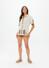 THE UPSIDE women's creme Vadella Collared Knit Shirt is made from organic cotton. It is a relaxed button up knit shirt and features a paisley design on a creme base. Designed for lounging and leisure.