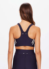 THE UPSIDE women's navy Cordoba Jade Racerback Bra is made from an eco tech performance fabric making the bra breathable and quick drying. The full coverage sports bra features an elasticated under bust and removable cups. Designed for the gym and running.