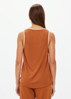 THE UPSIDE women's brown Zahara Jacquie Tank Top is made from a light slinky fabric. The tank is a retro basketball style tank with a contrast stripe on the neck and armholes. Designed for relaxed movement and leisure.
