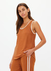 THE UPSIDE women's brown Zahara Jacquie Tank Top is made from a light slinky fabric. The tank is a retro basketball style tank with a contrast stripe on the neck and armholes. Designed for relaxed movement and leisure.