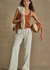 THE UPSIDE women's brown Zahara Jacquie Tank Top is made from a light slinky fabric. The tank is a retro basketball style tank with a contrast stripe on the neck and armholes. Designed for relaxed movement and leisure.
