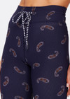 THE UPSIDE women's dark navy paisley Vadella 28in Yoga Pant is made form recycled textured rib fabric with moisture wicking properties. The mid rise legging features a striped elastic drawcord through the waist.