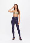 THE UPSIDE women's dark navy paisley Vadella 28in Yoga Pant is made form recycled textured rib fabric with moisture wicking properties. The mid rise legging features a striped elastic drawcord through the waist.
