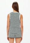 THE UPSIDE women's Portobello Watson Crochet Vest is hand crocheted in a two tone design of green and white. The waistcoat vest features a framed white stripe at the placket, armholes and welt pockets and accessories with white pearlised buttons. Designed for activity golf.