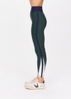 THE UPSIDE women's green Playoff 25 inch High Midi Pant is made from a recycled soft peached fabrication with a brushed handfeel, creating the pant to be breathable and quick drying. The green pant is paired with navy and white for an elevated look. Designed for golf.