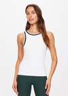 THE UPSIDE women's white Kirsty Rib Tank Top is made in recycled moisture wicking ribbed fabrication. The performance tank features a stylish stripped rib on the neckband and armholes. Designed for tennis.