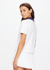 THE UPSIDE women's white Jacobs V Neck Collared Polo is made from organic cotton. The slim fit white polo is contrasted with navy and a rounded collar. Designed for golf.
