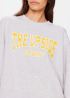THE UPSIDE women's grey Harbor Paloma Cropped Crew is made from organic cotton. The oversized crew features a ribbed neckline, cuffs and hem and a drop shoulder for a relaxed look. Designed for recovery and leisure.