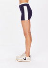 THE UPSIDE women's navy Montage Speechless Short is a knitted short with cream side panels and soft waistband for comfort. Designed for light movement and recovery.