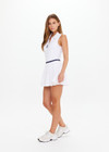 THE UPSIDE women's white Renshaw Beth Pleated Dress is made from recycled peached. The tennis dress features built in shorts with pockets. Designed for tennis and pickleball.
