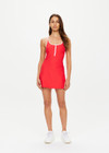 THE UPSIDE women's red Pacific Ali Racer Back Dress is made from recycled peached. The scoop neck tennis dress features built in shorts with pockets. Designed for tennis and pickleball.