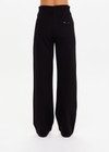 THE UPSIDE women's black Monte Pant is made from a lenzing viscose soft suiting fabrication. This high waisted wide leg pant features an elastic waistband, stripe tape down the side seams, and side seam and back patch pockets. Designed for leisure and recovery.