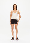 THE UPSIDE women's natural Canyon Freida Knit Fringe Top is made from organic cotton. The scoop neck top features knitted fringe. Designed for lifestyle wear.