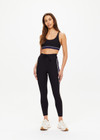 THE UPSIDE women's black Revolver Jade Racerback Bra is made from recycled rib. The supportive sports bra features removable cups. Designed for the gym and high impact exercise.