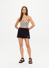 THE UPSIDE women's natural Luminary Lily Crochet Top is made from cotton. The crop top features scoop neck. Designed to wear over our ballet bras or bikini.