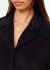 THE UPSIDE women's black Saddle Up Collared Hardy Shirt is made from hemp and cotton blend. The buttoned up shirt features pockets. Designed for comfort.